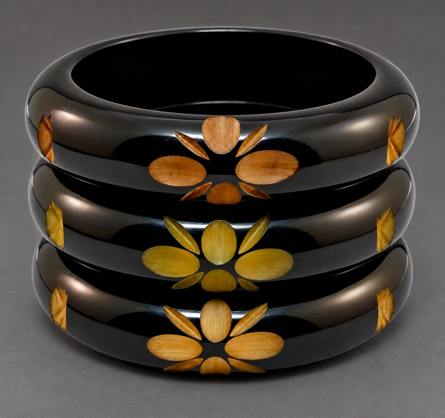 chunky black overdyed flower & star carved bakelite bangles